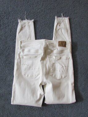 American Eagle Next Level Stretch White Tattered Size 0 Jeans High Rise Jeggings